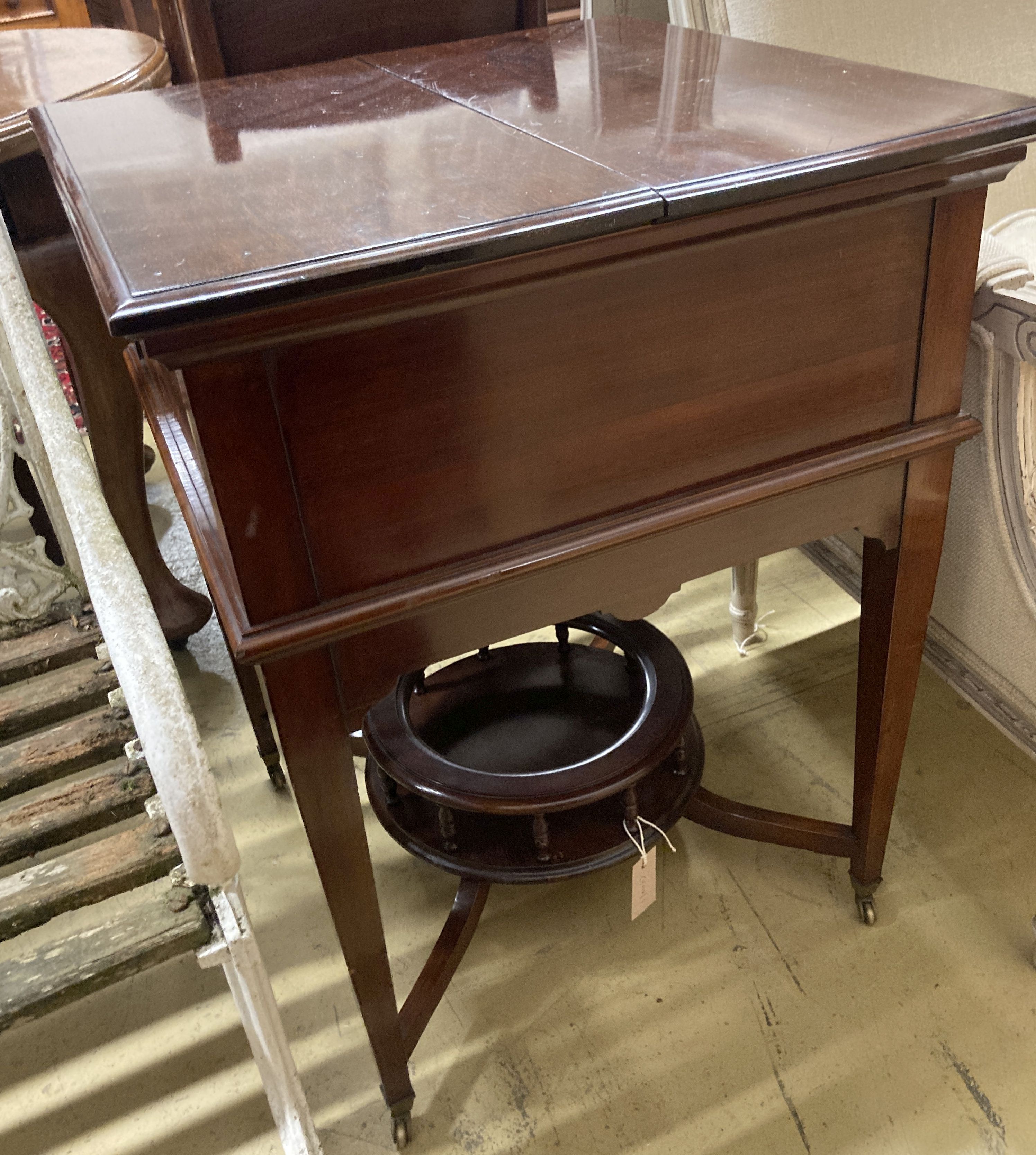 An Edwardian mahogany Surprise drinks table by Maple & Co., width 58cm, depth 60cm, height 76cm